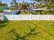 Fenced backyard offering ample green space, ensuring privacy and security for outdoor activities at 1631 Neva Dr, Largo, FL 33770