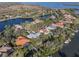 Beautiful aerial view of luxury homes in waterfront community with canals, access to the bay, and lush tropical landscaping at 1724 Amberwynd W Cir, Palmetto, FL 34221