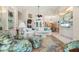 Inviting living room featuring an open floor plan, vaulted ceilings, and abundant natural light at 1724 Amberwynd W Cir, Palmetto, FL 34221