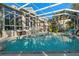 Stunning screened-in pool and backyard surrounded by lush landscaping provide the perfect setting for relaxation and entertaining at 1724 Amberwynd W Cir, Palmetto, FL 34221