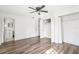 Bedroom featuring hardwood floors, a closet, and natural light at 1801 E Mcberry St, Tampa, FL 33610