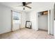 Bedroom featuring tiled floors, natural lighting, a ceiling fan, and closet at 1801 E Mcberry St, Tampa, FL 33610