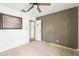 Bedroom with a neutral color scheme, featuring tiled flooring and a ceiling fan at 1801 E Mcberry St, Tampa, FL 33610