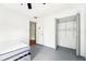 Bright bedroom featuring tiled flooring, a ceiling fan, and closet storage at 1801 E Mcberry St, Tampa, FL 33610