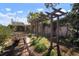 Charming backyard with a wooden pergola swing, a brick pathway, and a cozy fire pit at 1904 Pepperwood Pl, Brandon, FL 33510