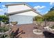 Side yard area features drought-resistant landscaping, defined borders and privacy fence at 1904 Pepperwood Pl, Brandon, FL 33510