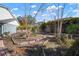 Picturesque backyard showcasing landscaping, a brick path, and privacy fencing at 1904 Pepperwood Pl, Brandon, FL 33510