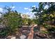 Expansive backyard featuring a brick path and lush greenery, offering a serene outdoor space at 1904 Pepperwood Pl, Brandon, FL 33510
