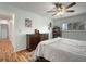 Large bedroom with wood-look floors and vintage dresser at 1904 Pepperwood Pl, Brandon, FL 33510