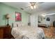 Cozy bedroom with ample natural light, ceiling fan, and mirrored closet at 1904 Pepperwood Pl, Brandon, FL 33510