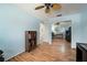 Well-lit office space with ceiling fan and closet with mirrored sliding door at 1904 Pepperwood Pl, Brandon, FL 33510