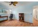 Comfortable office with plenty of natural light from the window and ceiling fan at 1904 Pepperwood Pl, Brandon, FL 33510