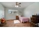 Charming bedroom features natural light and wood-look floors at 1904 Pepperwood Pl, Brandon, FL 33510