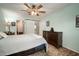 Spacious bedroom featuring a ceiling fan and a dresser at 1904 Pepperwood Pl, Brandon, FL 33510