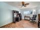 Office space with a large desk and plenty of natural light from the window at 1904 Pepperwood Pl, Brandon, FL 33510