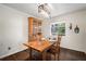 Charming dining area with wood table, hutch, and bright natural light at 1904 Pepperwood Pl, Brandon, FL 33510