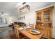 Dining room with wooden furniture open to living area at 1904 Pepperwood Pl, Brandon, FL 33510