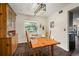 Cozy dining room features a wooden dining set and natural lighting at 1904 Pepperwood Pl, Brandon, FL 33510