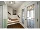 Inviting entryway featuring decorative glass doors and hardwood stairs at 1904 Pepperwood Pl, Brandon, FL 33510