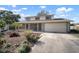 Charming two-story home with a covered front porch, large driveway and an attached two car garage at 1904 Pepperwood Pl, Brandon, FL 33510