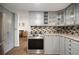 Modern kitchen features updated cabinets, stainless steel appliances, and cozy finishes at 1904 Pepperwood Pl, Brandon, FL 33510