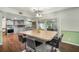 Kitchen island with bar seating, pendant lighting, and modern finishes at 1904 Pepperwood Pl, Brandon, FL 33510