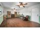 Bright and airy living room with wood look floors, green wainscoting, and shelving at 1904 Pepperwood Pl, Brandon, FL 33510