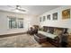 Comfortable living room with leather furniture, area rug, and natural light at 1904 Pepperwood Pl, Brandon, FL 33510