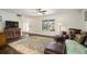 Inviting living room with tile floors, cozy seating, and natural light at 1904 Pepperwood Pl, Brandon, FL 33510