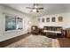 Cozy living room with carpet, comfortable leather seating, and decor at 1904 Pepperwood Pl, Brandon, FL 33510