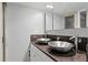 Modern bathroom with double vanity, vessel sinks, granite countertop, and updated fixtures at 201 W Laurel St # 1006, Tampa, FL 33602