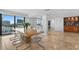 Open concept dining and living area featuring skyline views, perfect for modern living and entertaining at 201 W Laurel St # 1006, Tampa, FL 33602