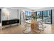 Modern dining room with cityscape views, stylish decor, and seating for six, perfect for entertaining at 201 W Laurel St # 1006, Tampa, FL 33602