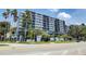 Apartment building exterior, sign says, 'One Laurel Place', has palm trees and nice landscaping at 201 W Laurel St # 1006, Tampa, FL 33602