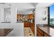 Modern kitchen featuring custom wood cabinetry, granite countertops and stainless steel appliances at 201 W Laurel St # 1006, Tampa, FL 33602