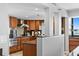 Well-equipped kitchen boasting wooden cabinets, stainless steel appliances, and ample counter space at 201 W Laurel St # 1006, Tampa, FL 33602