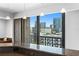 Lovely city view from breakfast bar framed by the window, pendant lights, and granite counters at 201 W Laurel St # 1006, Tampa, FL 33602