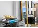 Stylish living room décor, featuring glossy black cabinets, gold accents, and cityscape views at 201 W Laurel St # 1006, Tampa, FL 33602