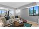 Inviting living room featuring a comfortable couch, hardwood table, and city views at 201 W Laurel St # 1006, Tampa, FL 33602