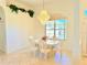 Bright dining room with chandelier and large window at 2329 Como St, Port Charlotte, FL 33948
