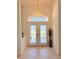 Foyer featuring stylish chandelier and decorative trim at 2329 Como St, Port Charlotte, FL 33948