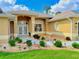 Home entrance and walkway featuring decorative landscaping and exterior lighting at 2329 Como St, Port Charlotte, FL 33948