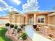 Home entrance and walkway featuring decorative landscaping and exterior lighting at 2329 Como St, Port Charlotte, FL 33948