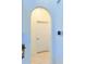 Hallway with tiled flooring, white walls and an arched doorway to an adjacent room at 2329 Como St, Port Charlotte, FL 33948