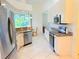 Spacious eat-in kitchen with stainless appliances and granite countertops at 2329 Como St, Port Charlotte, FL 33948