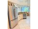 Well-lit kitchen features stainless appliances, granite counters, and a breakfast nook with pool views at 2329 Como St, Port Charlotte, FL 33948