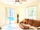 Spacious living room featuring sliding glass doors with pool view at 2329 Como St, Port Charlotte, FL 33948