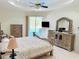 Spacious main bedroom with sliding glass door access to the pool at 2329 Como St, Port Charlotte, FL 33948