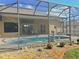 Screened-in pool with outdoor dining and easy access from house at 2329 Como St, Port Charlotte, FL 33948