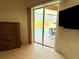 View through the sliding glass doors to the screened-in pool and patio area at 2329 Como St, Port Charlotte, FL 33948